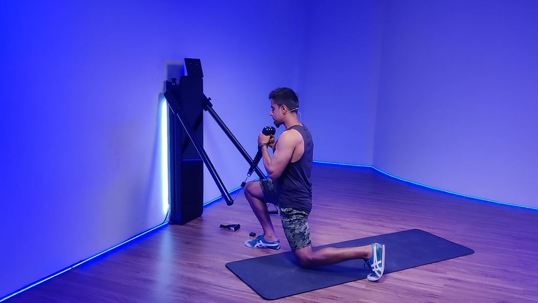 Man performing a rope forward lunge exercise in a gym setting