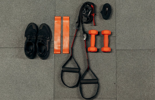 Home gym equipment for strength training including dumbbells and resistance bands