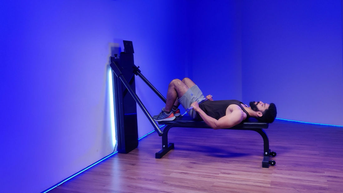 A man performing a barbell bench hip thrust exercise on a bench