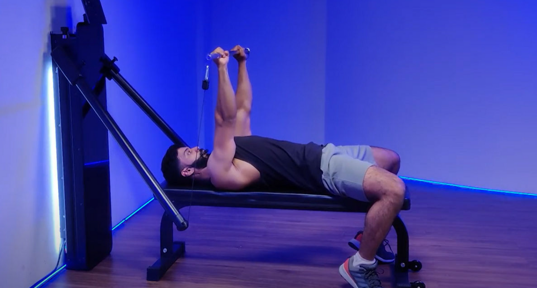 Man performing a Barbell Chest Press exercise at the gym