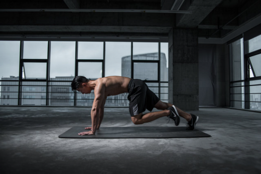 Man performing resistance training exercises in a gym