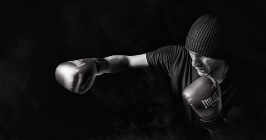 A male boxer training and preparing to build muscle.