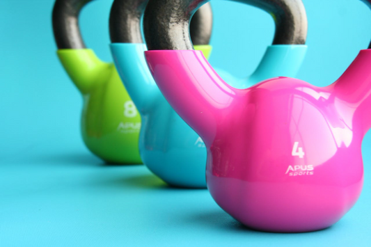 Colorful kettlebells for strength training exercises in the gym